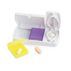Pill box with lid, 2 removable, different coloured compartments and separate cutter enabling management and transport of medication